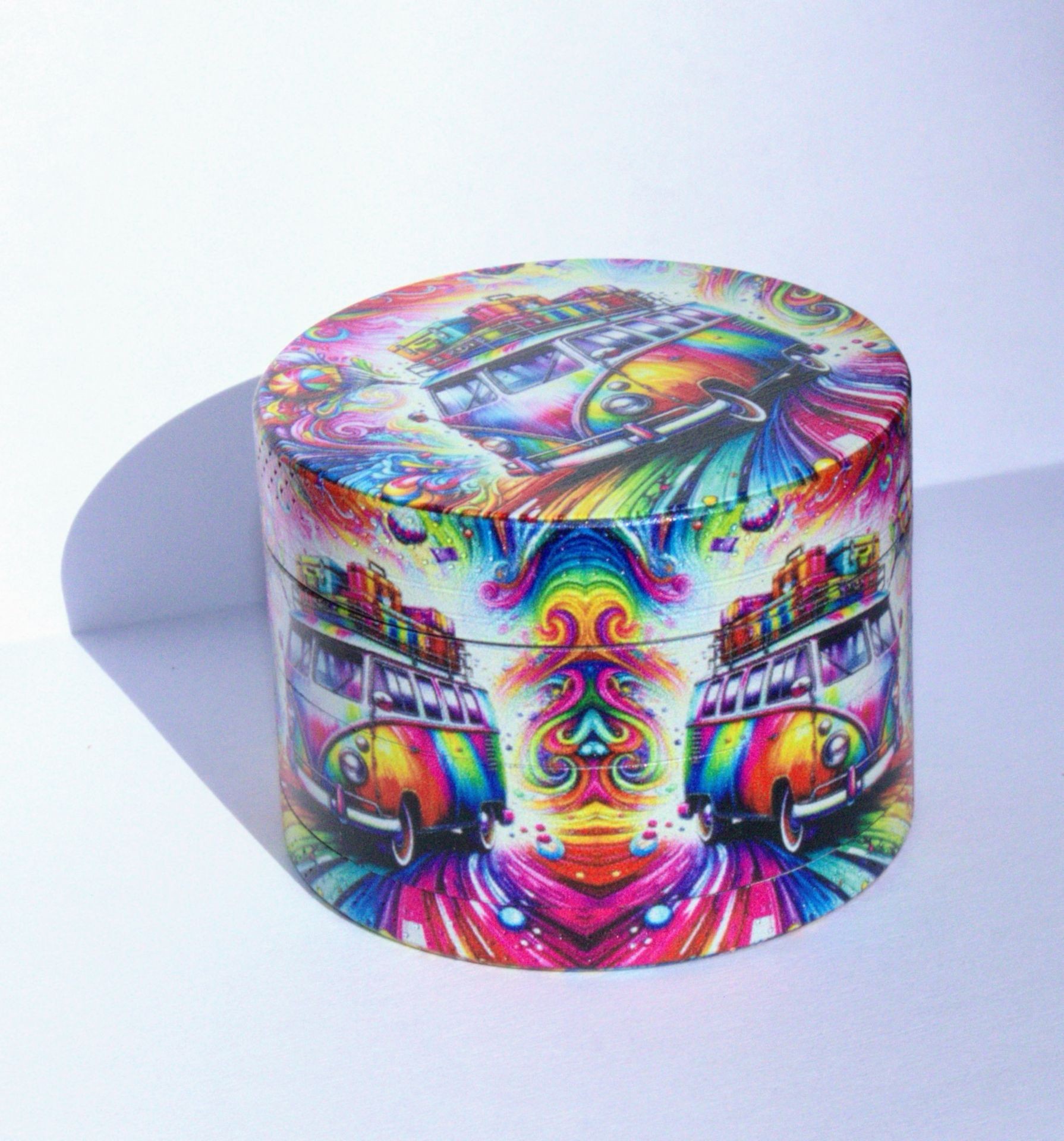 Colorful cylindrical box with psychedelic van artwork and vibrant swirls.